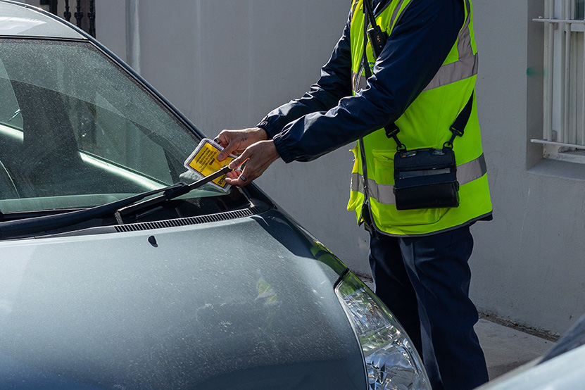 car getting a parking fine