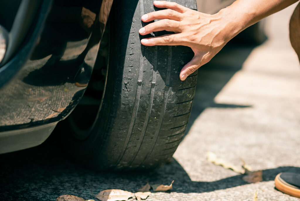 person checking tyre