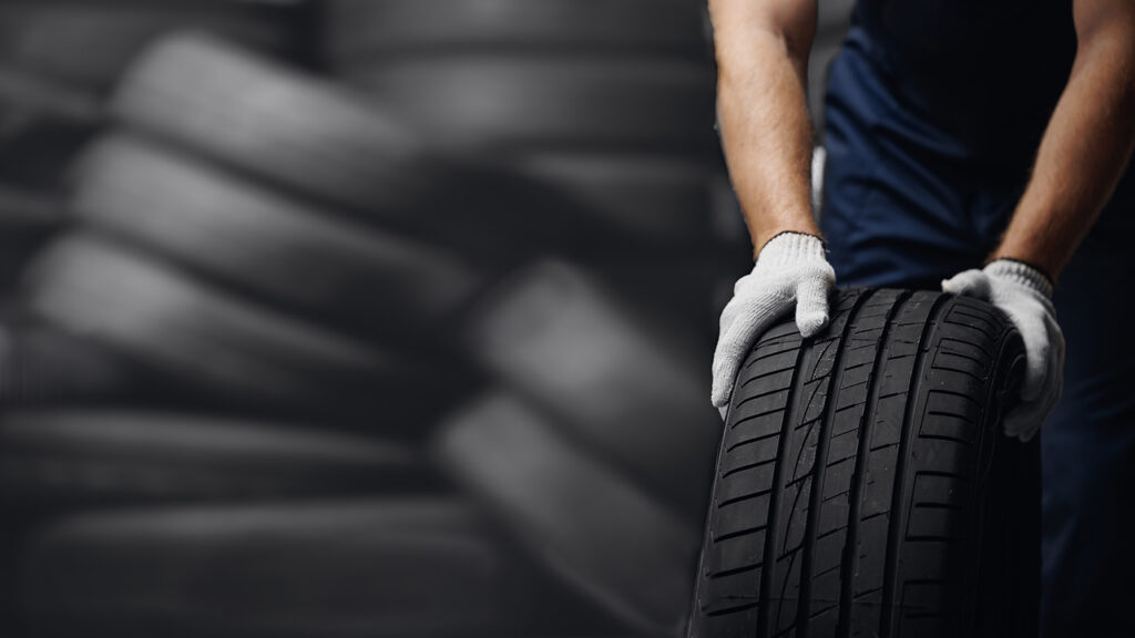 Mechanic with new tyres