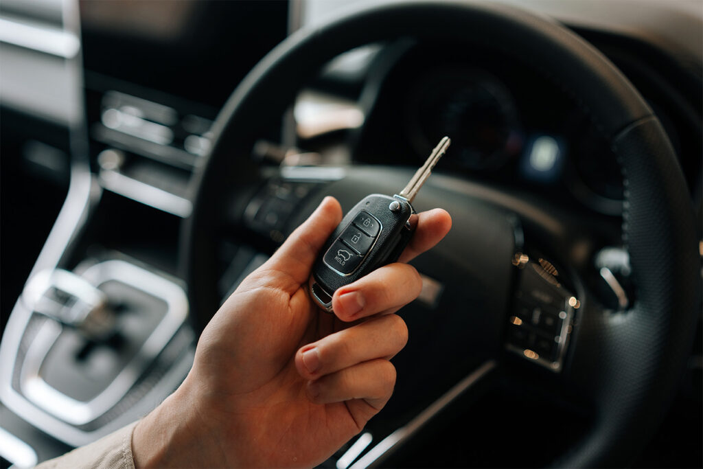 Driver holding keys