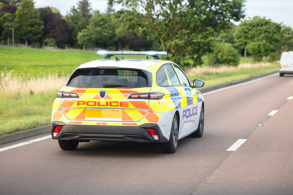police vehicle maintaining road safety