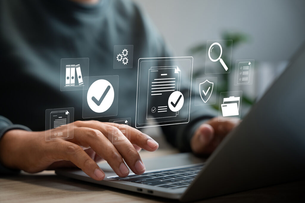 person doing licence check audit on laptop