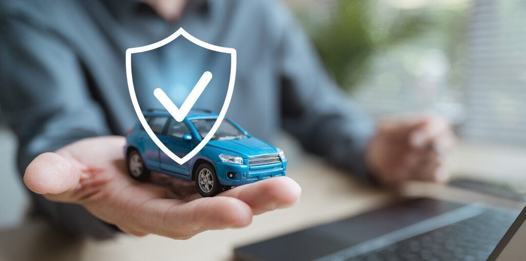 toy car on hand with insurance
