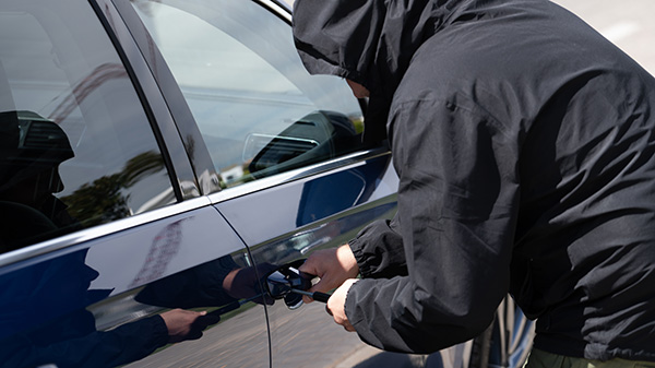 man trying to steal vehicle